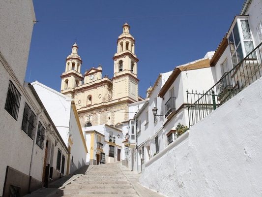 View of Olvera church from the narrow steps up to it.
