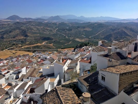 The white houses of Olvera from a more brides eye perspective with the vast fields, olive groves and mountains in the distance